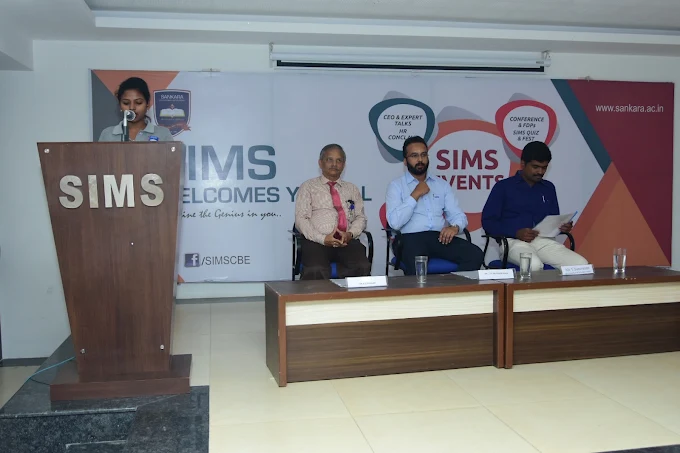 Speakers participating in a professional conference panel