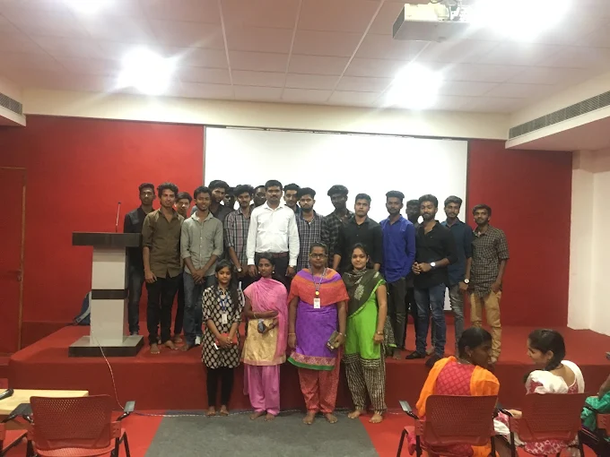 Participants and facilitators gathered on stage after a professional learning programme
