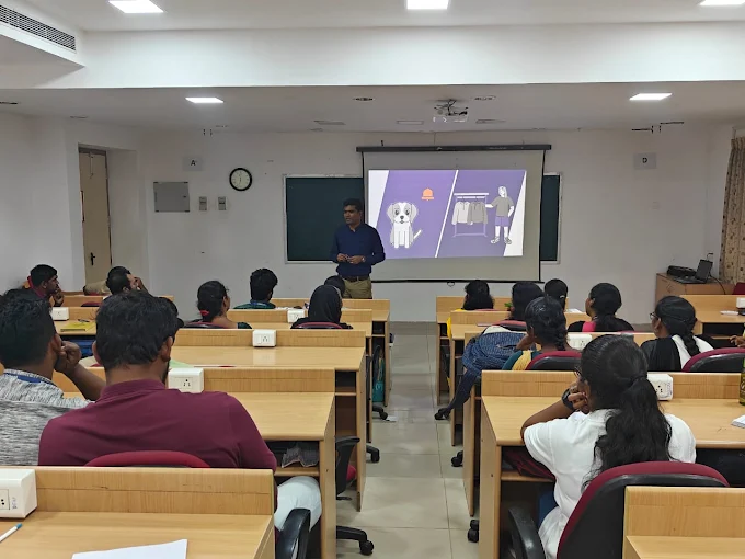 Facilitator using a visual scenario during an interactive classroom session